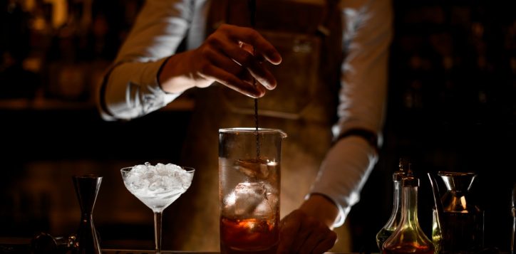 bartender-stirring-cocktail-measuring-glass-cup-2